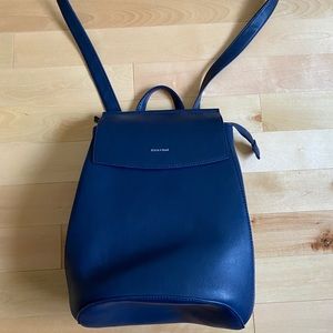 Backpack converts to a side purse pixie mood dark blue vegan leather